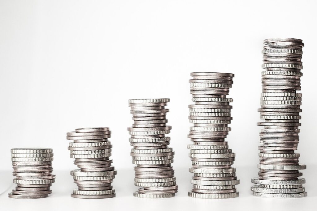 Stacks of coins rising in height from left to right